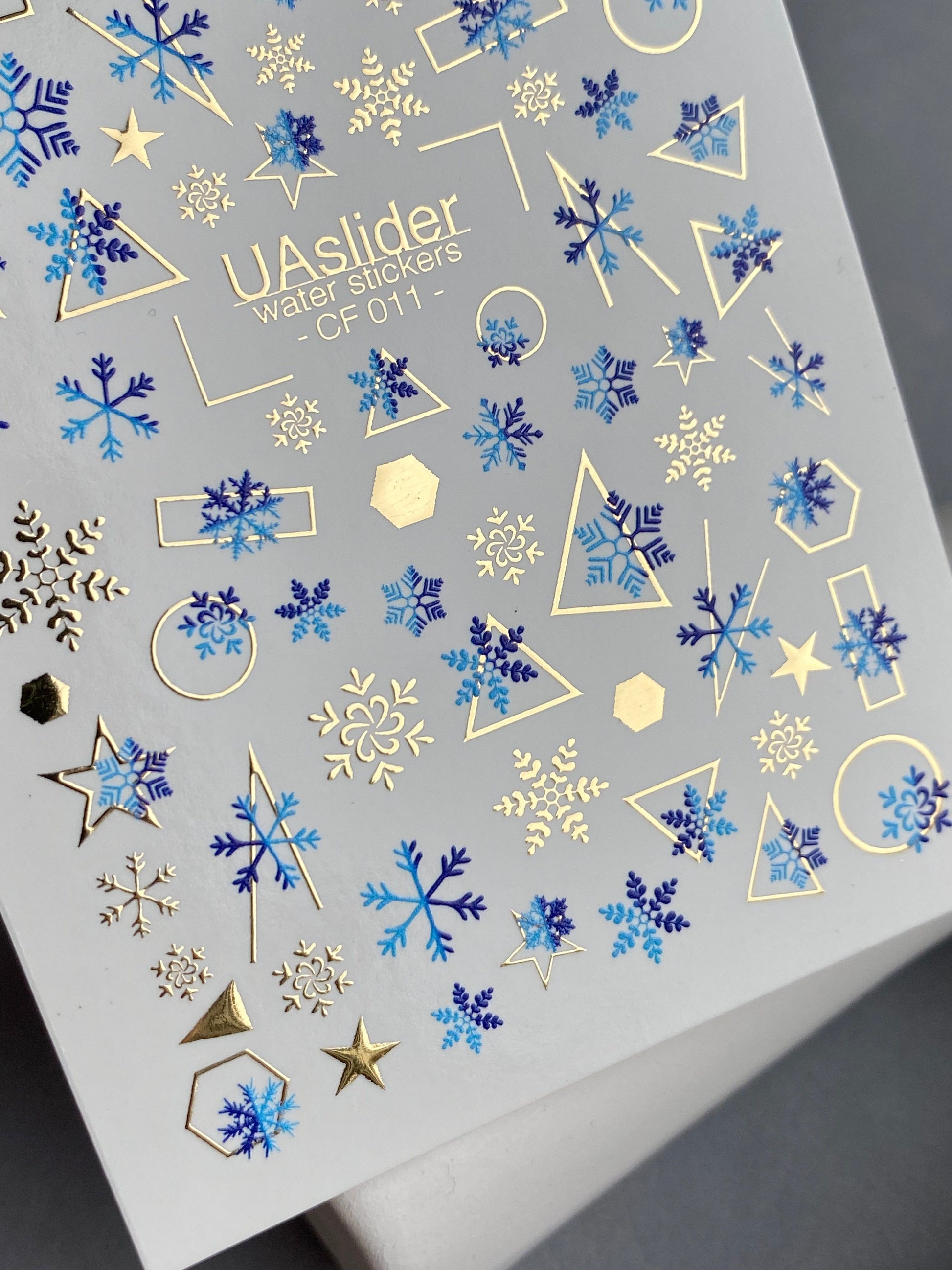 UA Slider 2D Nail Decal CF-011 Water Slide Nail Decals Blue Snowflakes with Gold Foil Geometric Accents