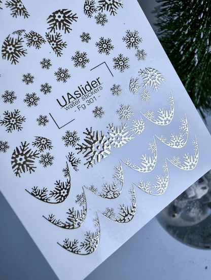 FG-301 gold foil snowflakes and snowflake French tip arches nail decals close up